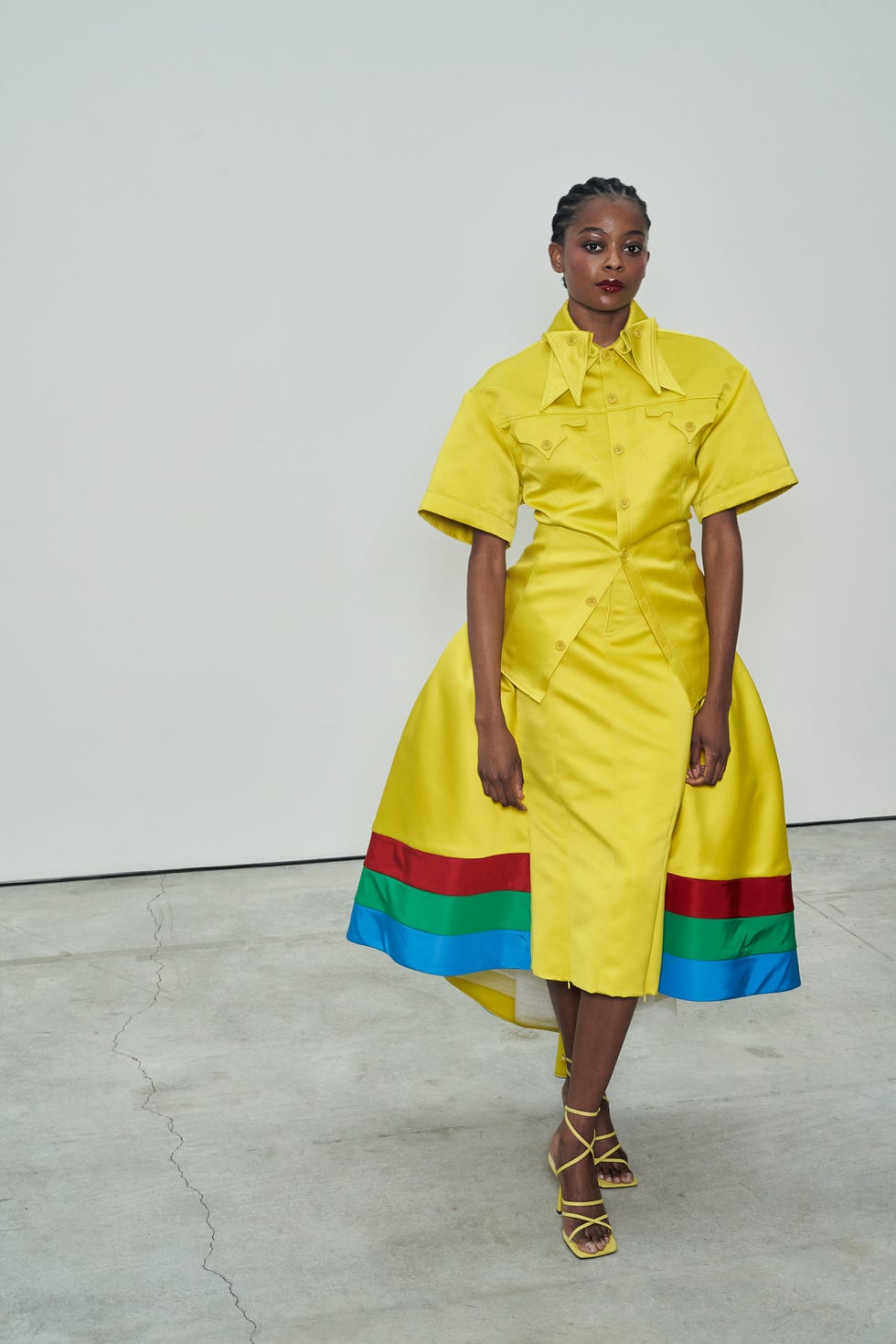 a person wearing a yellow dress