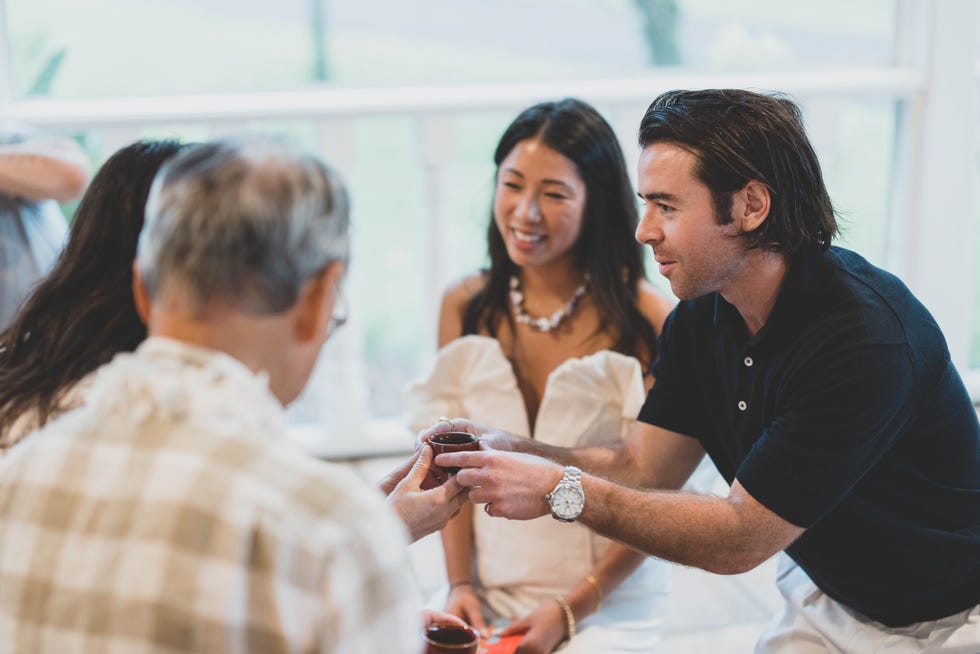 a group of people having a conversation