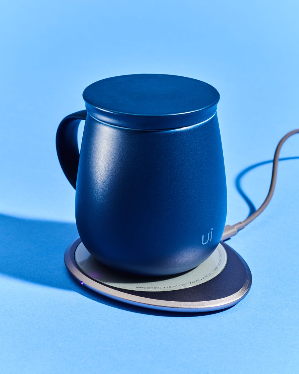 a blue mug on a charging coaster against a matching background