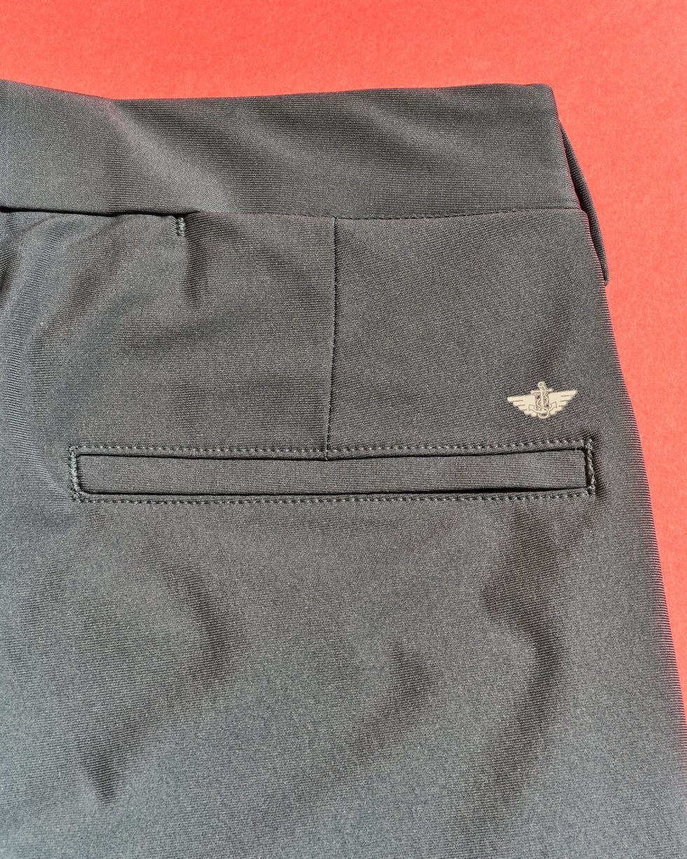 back of black pants with a pocket and a logo