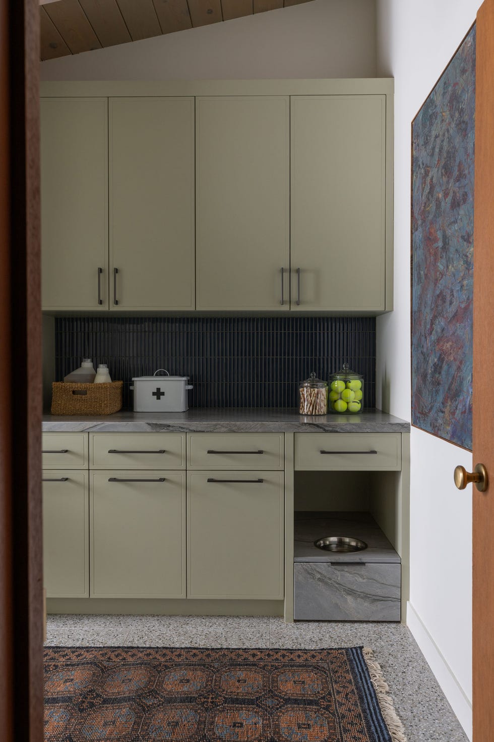Modern kitchen corner with cabinets countertop and pet feeding area modern kitchen corner with cabinets countertop and pet feeding area