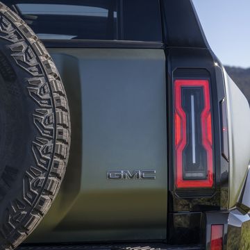 close up of rear passenger side taillight on 2024 gmc hummer ev suv parked at off road mountain vista