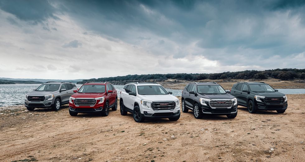 front group view of the 2024 gmc terrain lineup, including sle, slt, at4 and denali trims and available elevation edition