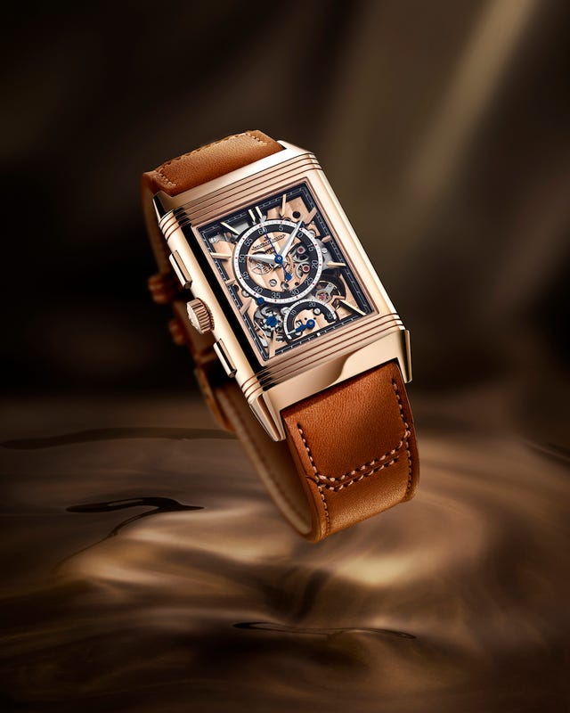 luxury mechanical watch with a transparent face and leather strap