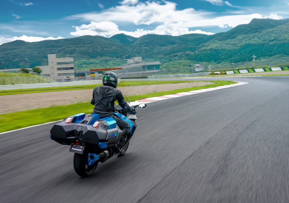 a person riding a motorcycle on a road