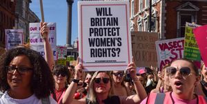 london, united kingdom, protester holds a placard which says will britain protect womens rights