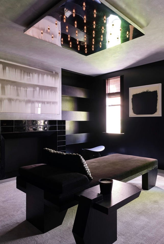 a room with a fireplace and couches a room with a fireplace and couches