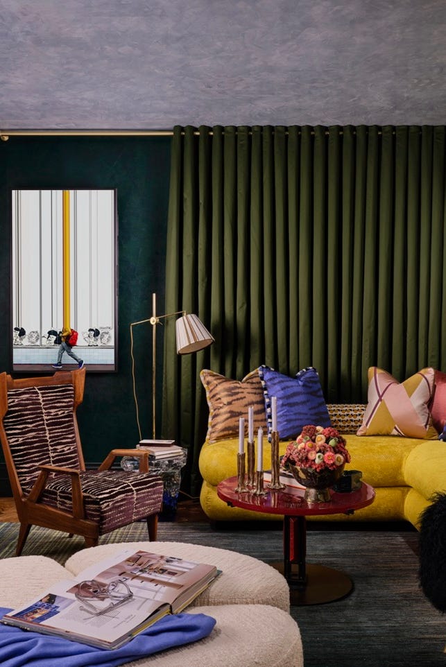 a living room with a couch and a table a living room with a couch and a table