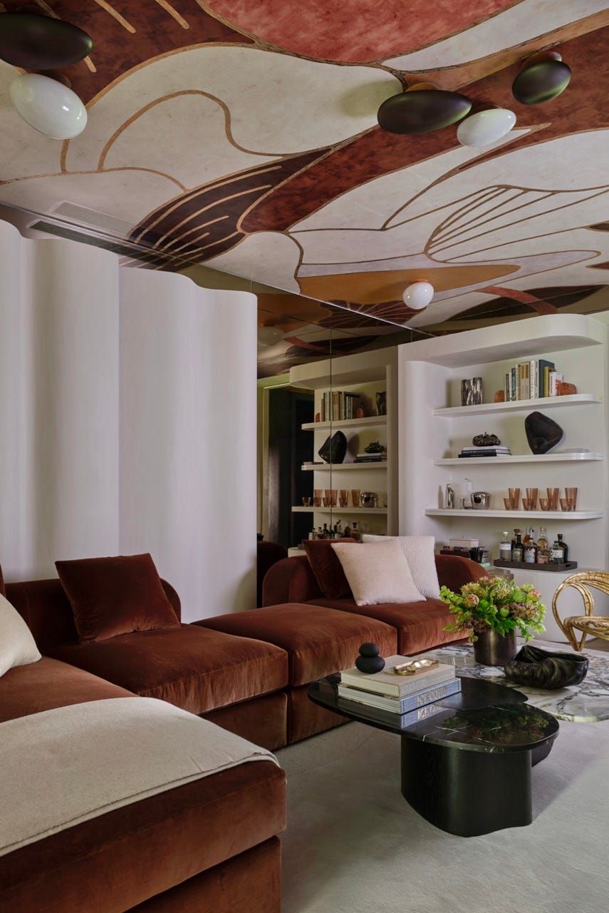 a living room with a ceiling fan a living room with a ceiling fan