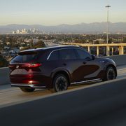 2024 mazda cx90 driving on an interstate