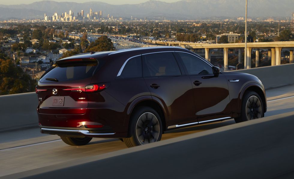 2024 mazda cx90 driving on an interstate