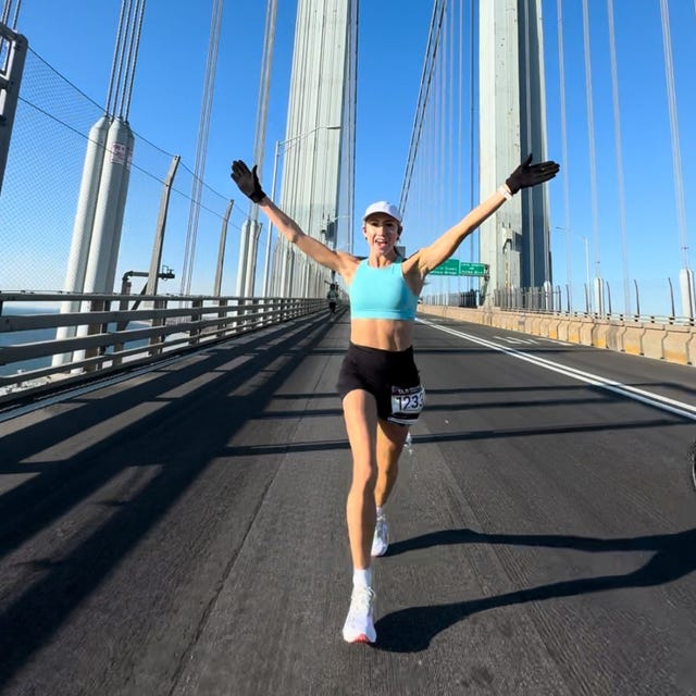 runner celebrating on a bridge during a race