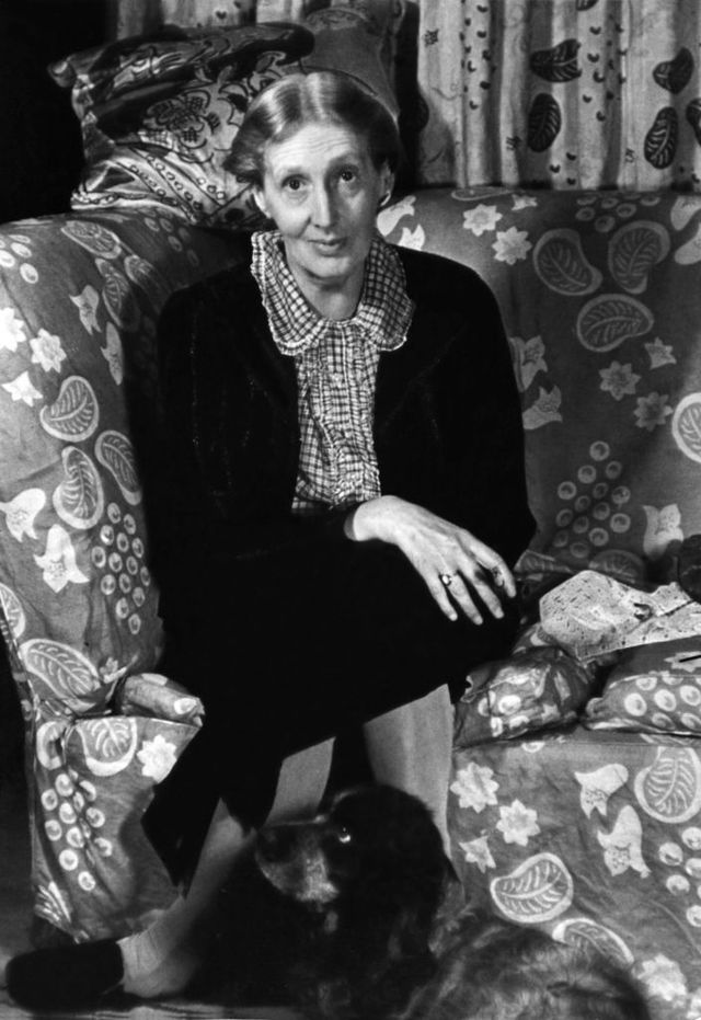 portrait of english author virginia woolf 1882 1941 as she sits cross legged on a couch, with her cocker spaniel, pinka, at her feet, london, england, 1939 photo by gisele freundphoto researchers historygetty images