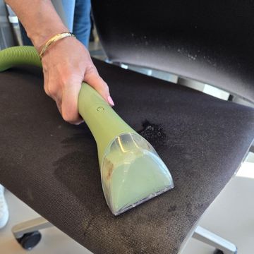 best upholstery cleaners testing an upholstery cleaner on a chair seat