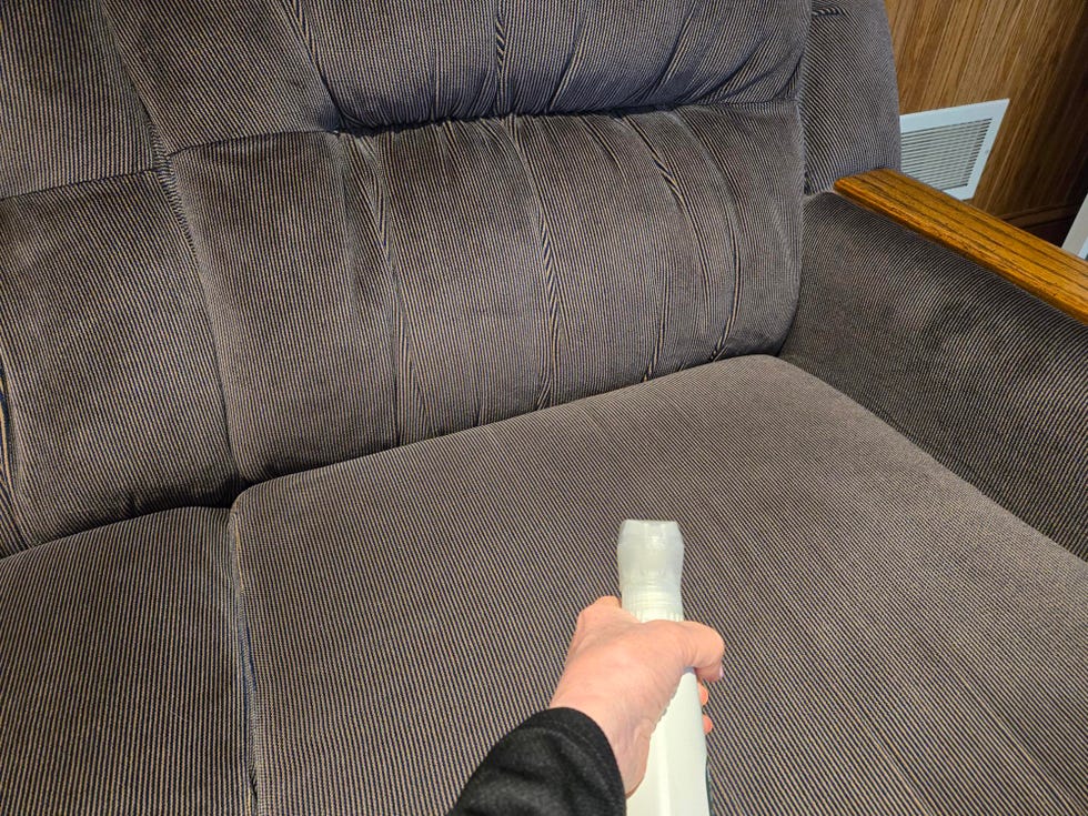 best upholstery cleaners testing a spray cleaner on a couch