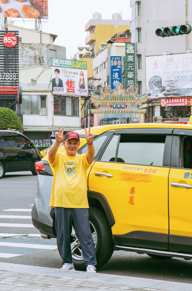 a person standing next to a yellow car on a street