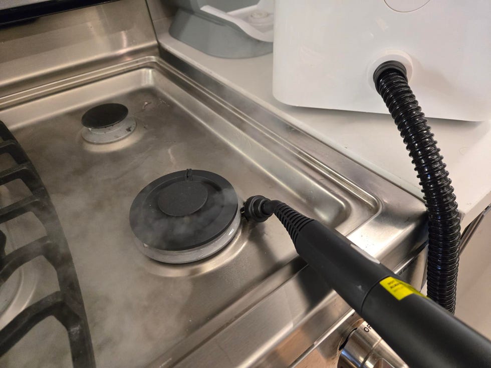 best steam cleaners testing the dupray neat steam cleaner on a stovetop