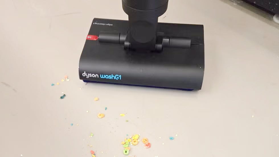 dyson washg1on a flat surface with scattered colorful cereal pieces
