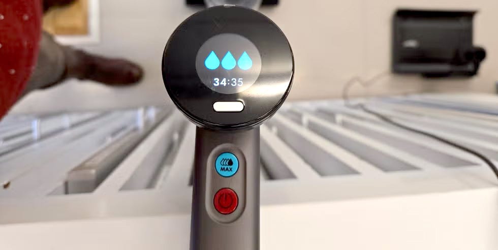 control panel of dyson washg1 wet floor cleaner and displaying settings