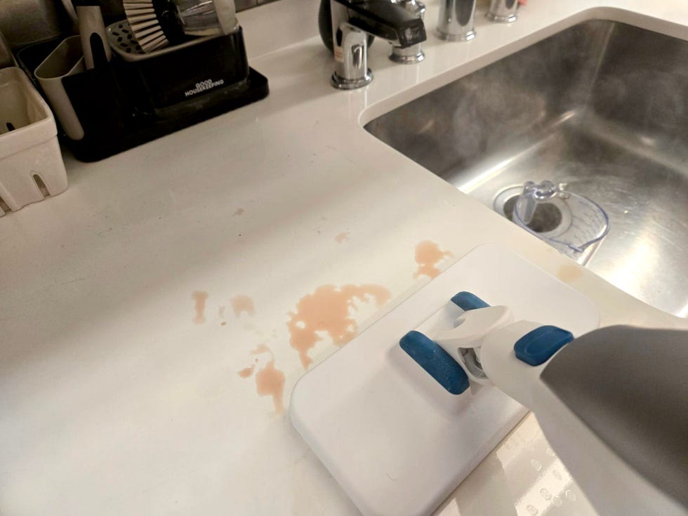 black and decker steam cleaners cleaning a countertop with spilled grape juice stains stains