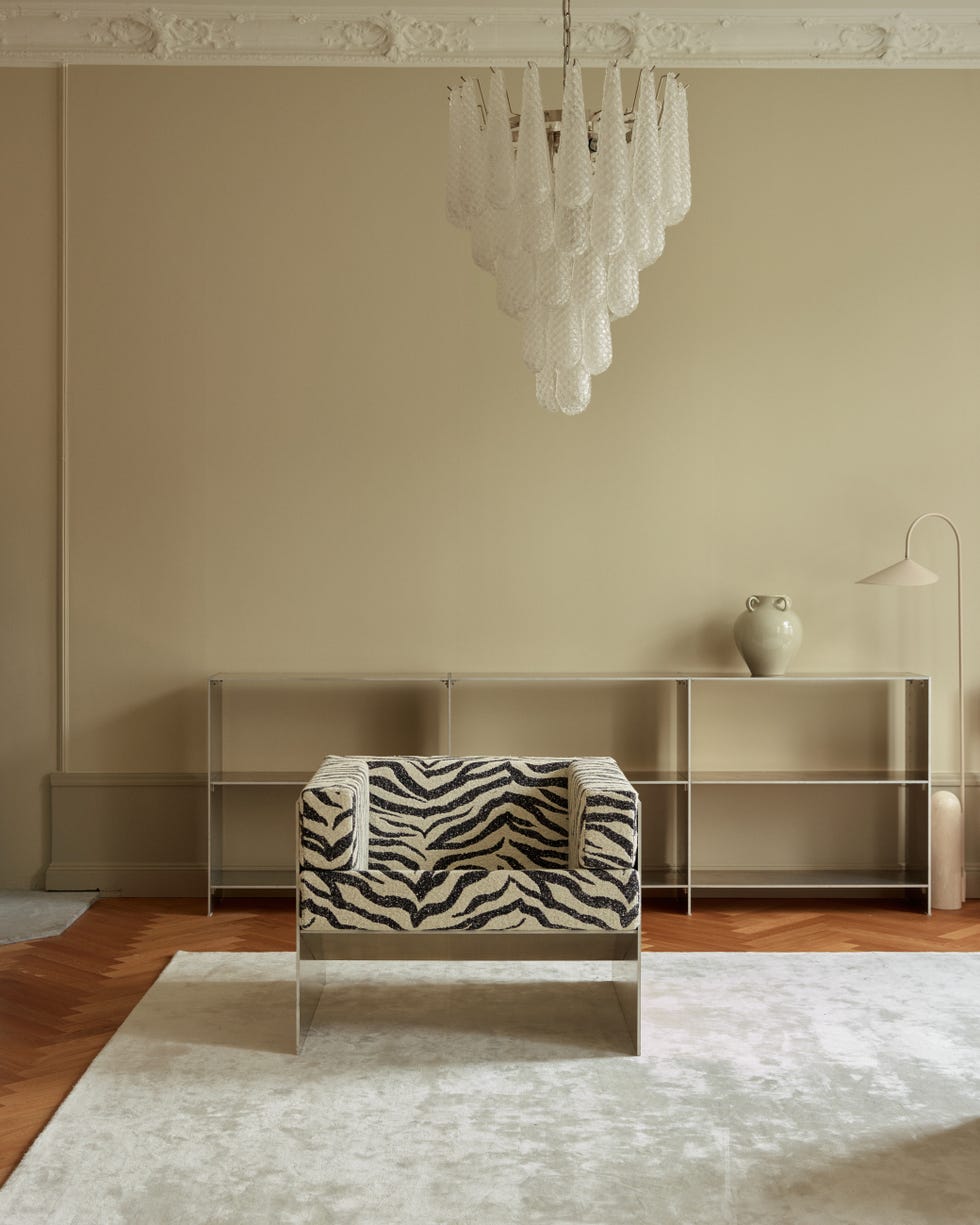 an aluminium armchair with zebra patterned upholstery