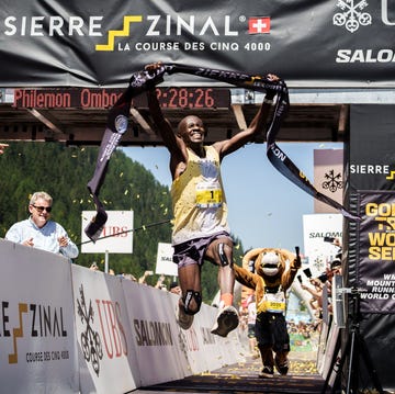runner crossing the finish line at an outdoor race event sierre zinal 2025 runner crossing the finish line at an outdoor race event sierre zinal 2025