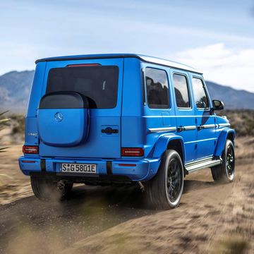 a blue 2025 mercedes g 580 with eq technology on a dirt road