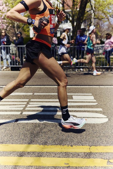 body of a runner taking part in a road marathon