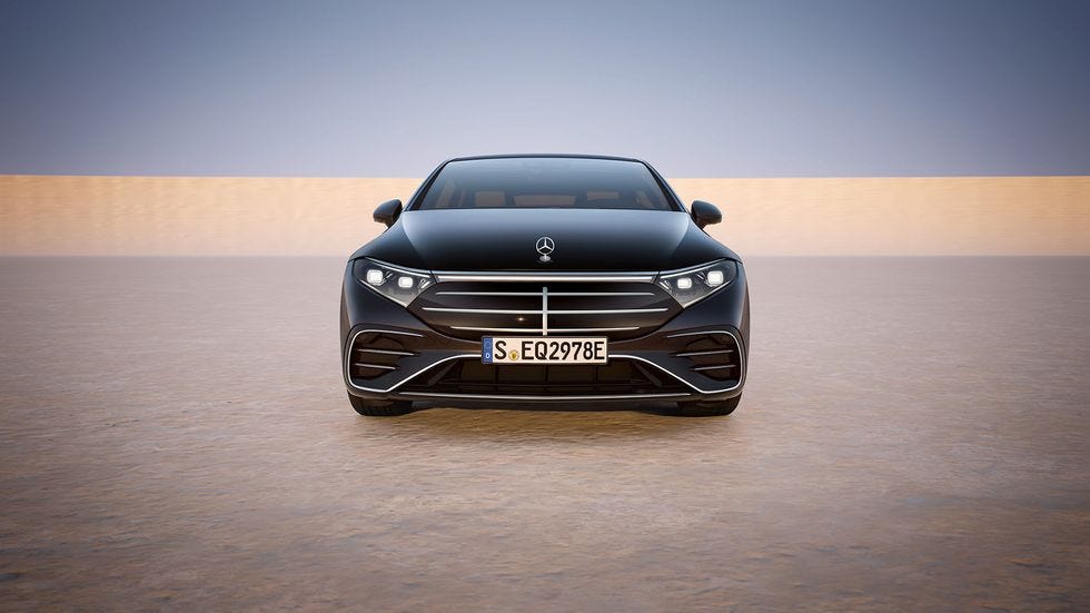 a black car driving on a road