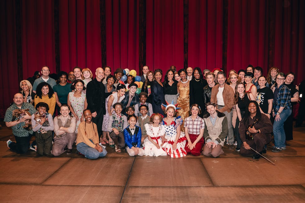 group photo at an event with diverse attendees in various outfits