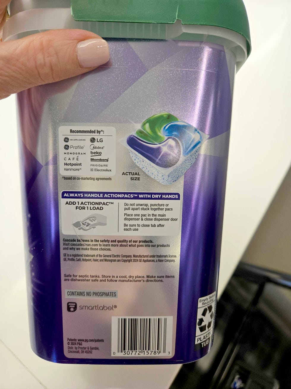 best dishwasher tablets reading the label of a tub of dishwasher tablets