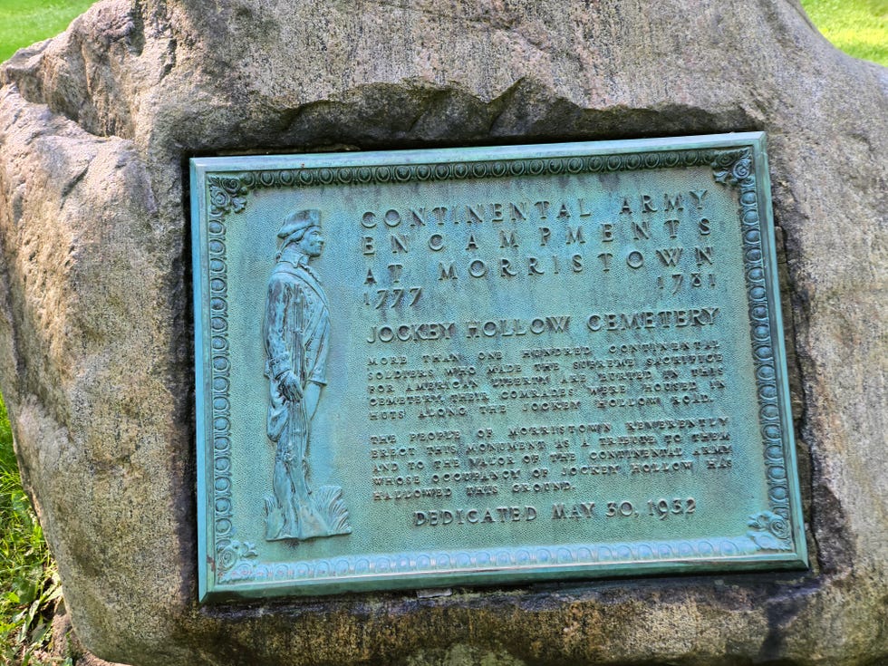 bronze memorial plaque on a rock in jockey hollow, new jersey