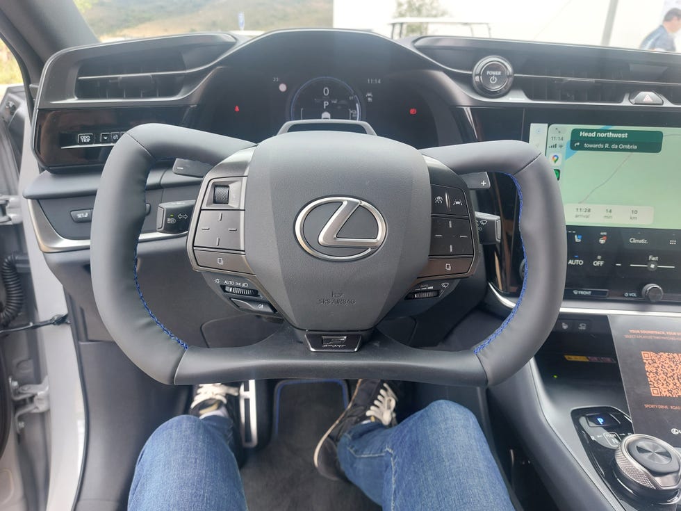 interior view of a lexus vehicle highlighting the steering wheel and dashboard interior view of a lexus vehicle highlighting the steering wheel and dashboard