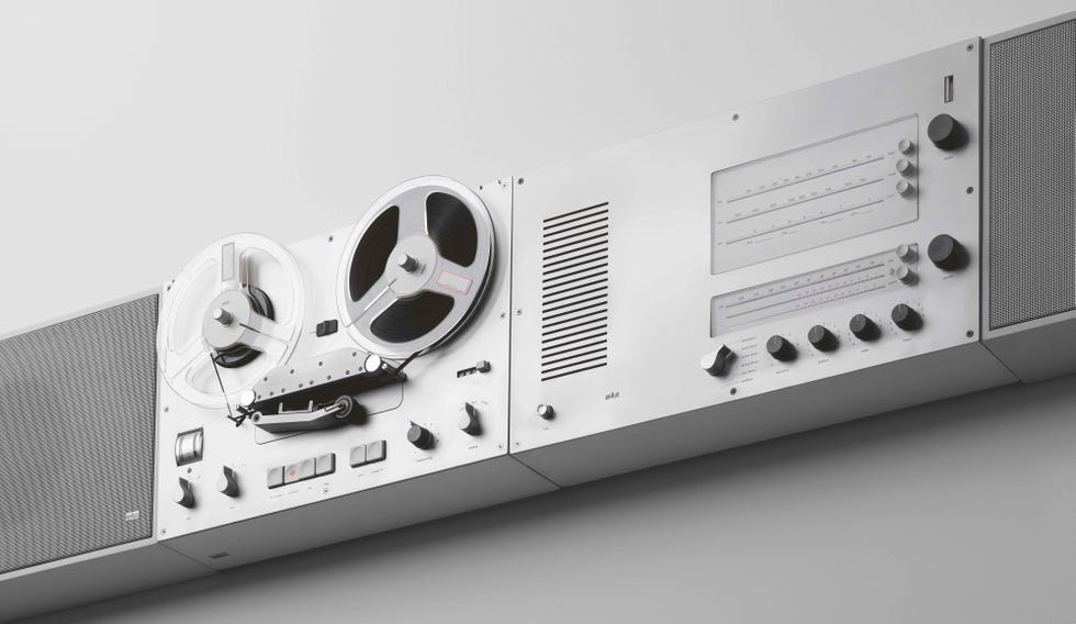 a white rectangular object with a black and silver knobs a white rectangular object with a black and silver knobs
