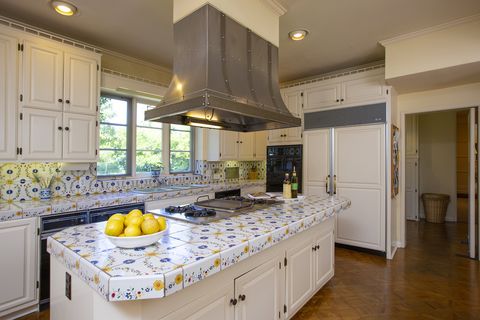 Countertop, Room, Kitchen, Cabinetry, Furniture, Property, Yellow, Interior design, Building, Ceiling, 
