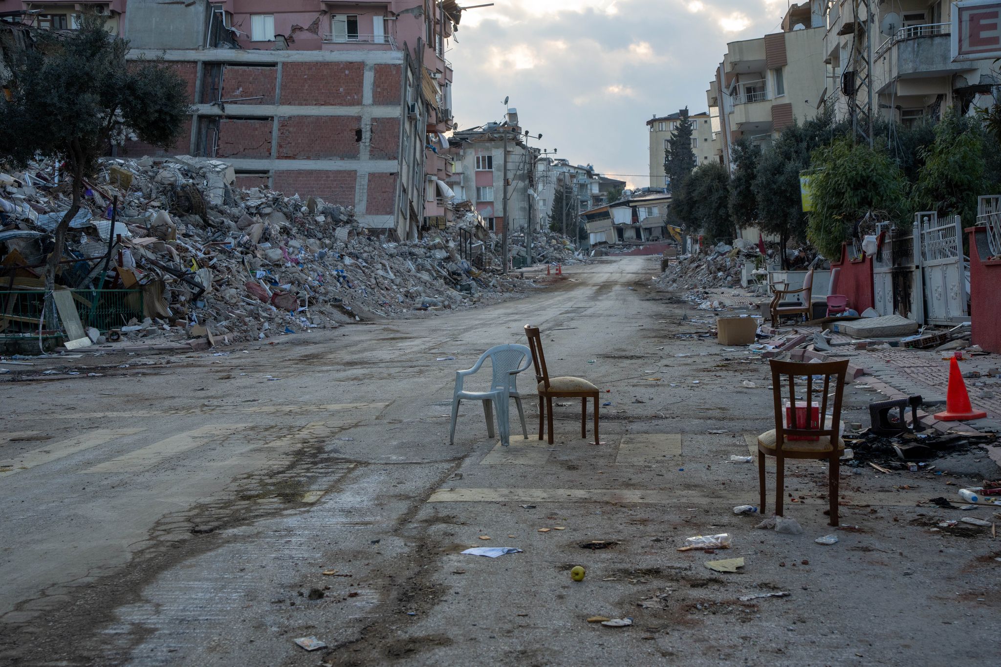 2023 antakya turkey chairs are scattered around the sites of collapsed buildings where family members kept vigil waiting for rescue workers to discover the remains of loved ones, or in rare cases, find them alive on february 6, 2023, a 78 magnitude earthquake hit central and southern turkey, and northern syria it was followed by a 77 magnitude earthquake it is estimated that there were 45,000 deaths in turkey, and approximately 7,000 in syria