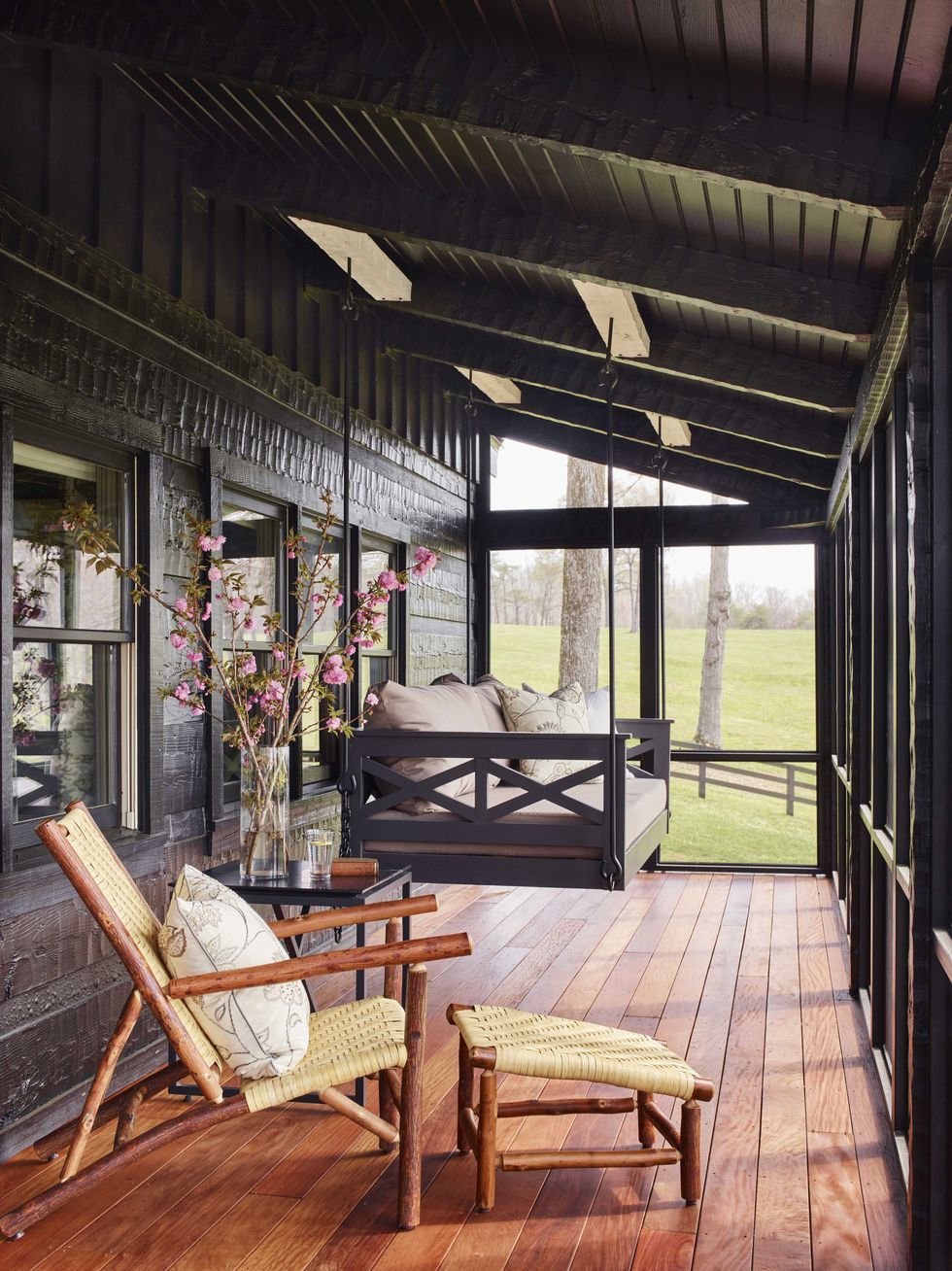 screened in porch, hanging chair, wooden lounge chair