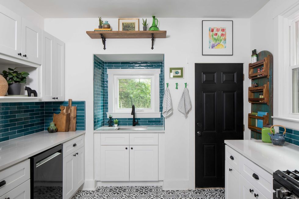 kitchen, white cabinets, black door, teal subway tile backsplash