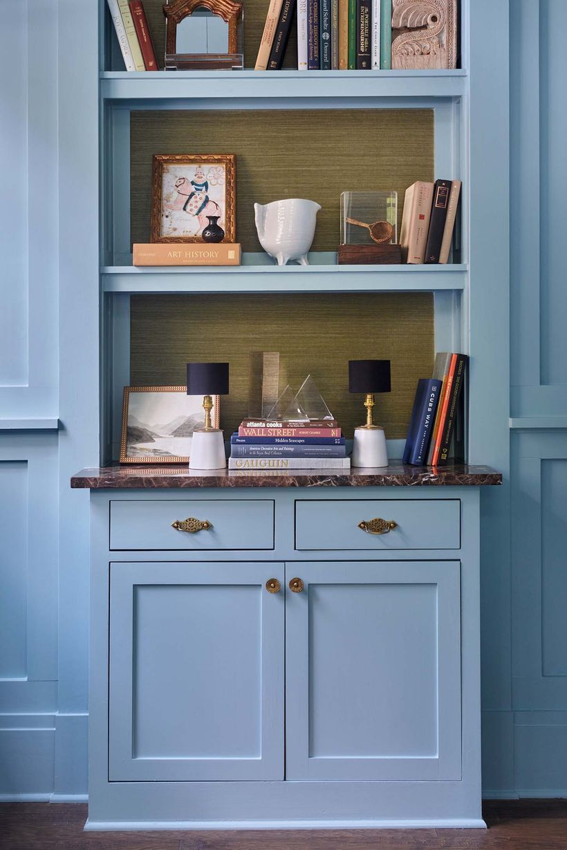 blue bookcase with green shelves
