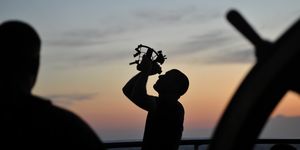 senior chief petty officer mike rosati uses a sextant while conducting celestial navigation training while sailing on the atlantic ocean aboard the coast guard cutter eagle, aug 3, 2015 celestial navigation is taught to the coast guard academy cadets while they spend time underway on the eagle us coast guard photo by petty officer 2nd class matthew s masaschi