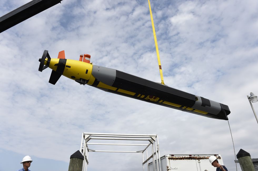 150920 n po203 174 patuxent river, maryland sept 20, 2015 a remus 600 autonomous underwater vehicle auv from the university of texas at austin is offloaded following a mission during the office of naval research sponsored demonstration of unmanned undersea vehicles uuv at naval air station patuxent river, md the event, pax river 2015, brought together 150 participants, 26 technology teams and unmanned systems to jointly explore uuv technologies in common, at sea environments us navy photo by john f williamsreleased