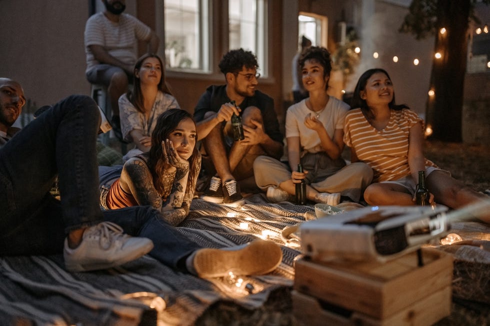 group of friends watching a movie together