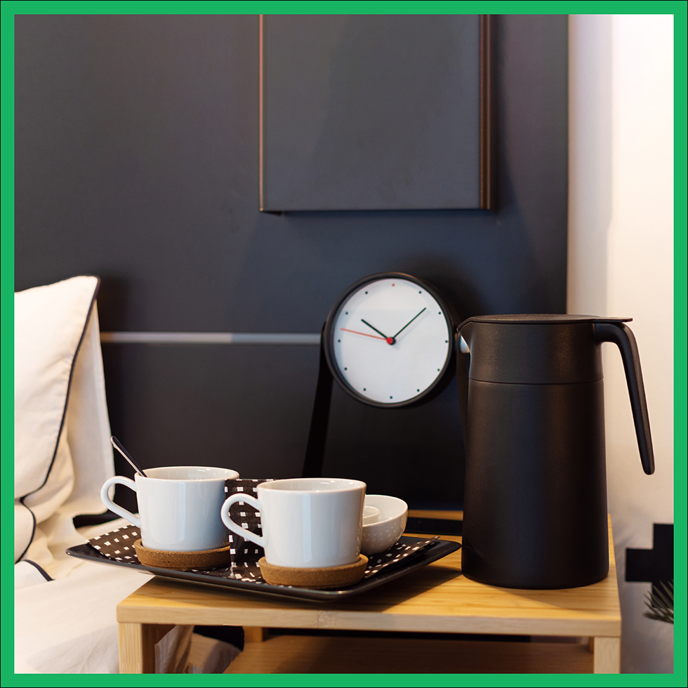 clock and cup on the table