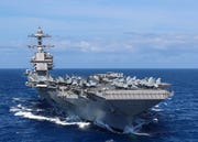 aircraft attached to carrier air wing cvw 8 sit on uss gerald r ford's cvn 78 flight deck as the ship steams through the atlantic ocean, april 13, 2022 ford is underway conducting carrier qualifications and strike group integration prior to operational deployment us navy photo by mass communication specialist 2nd class riley mcdowell