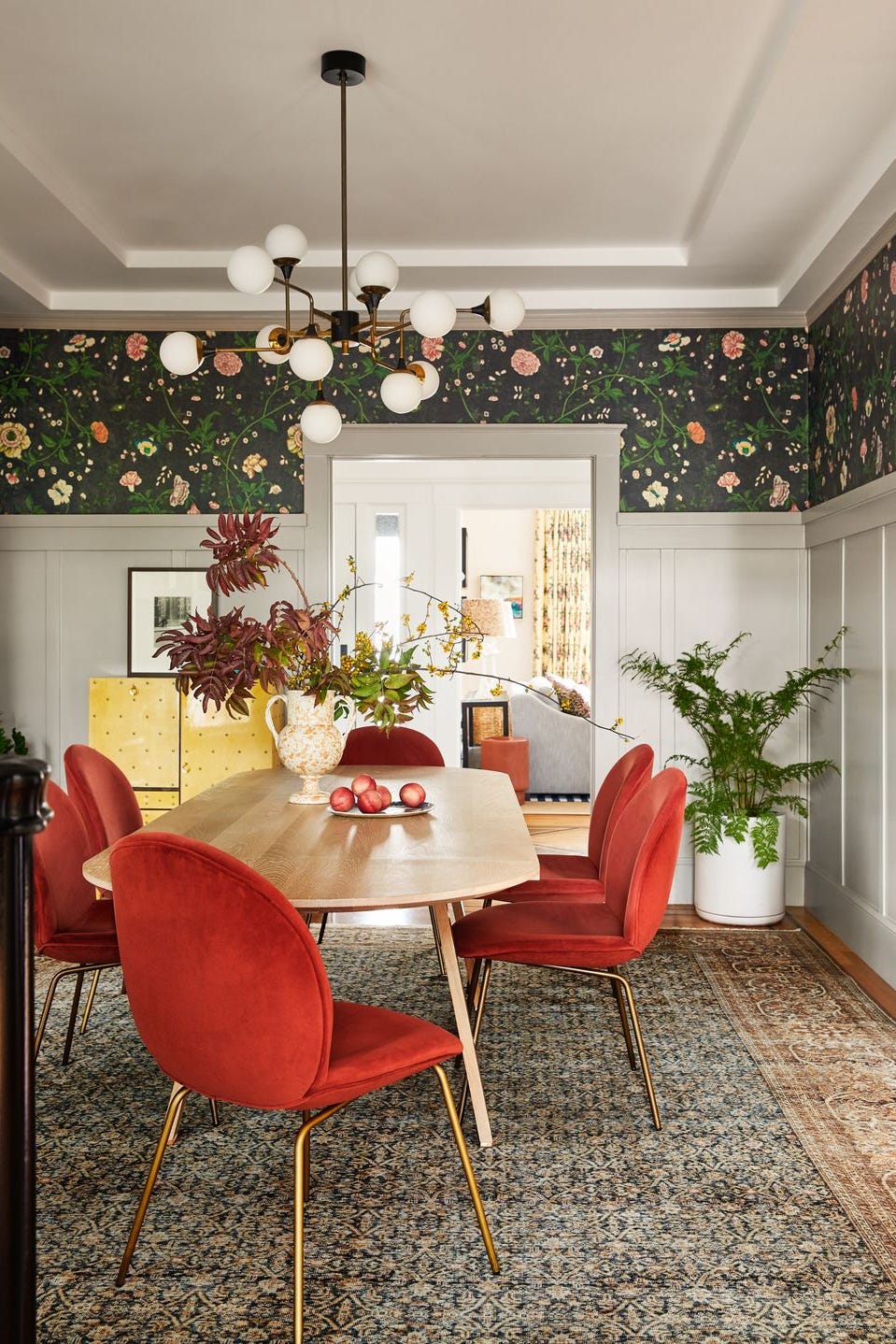 Dining room table with red chairs