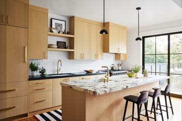 a kitchen with a marble island