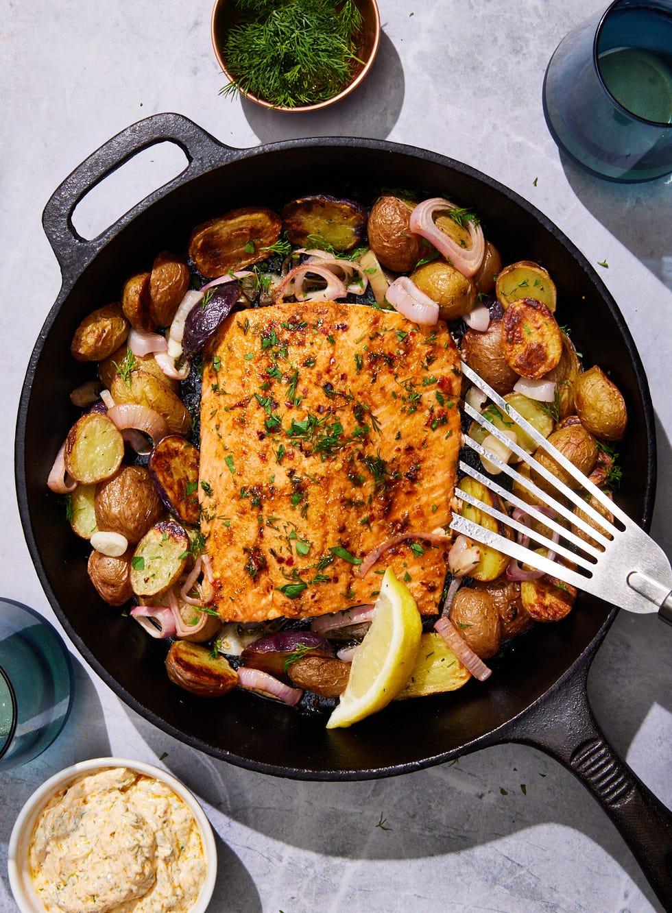 baked salmon potato skillet with shallots and dill yogurt sauce