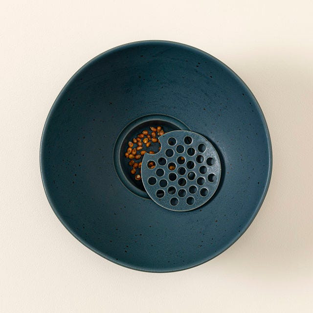 uncommon goods popcorn bowl with kernel sifter
