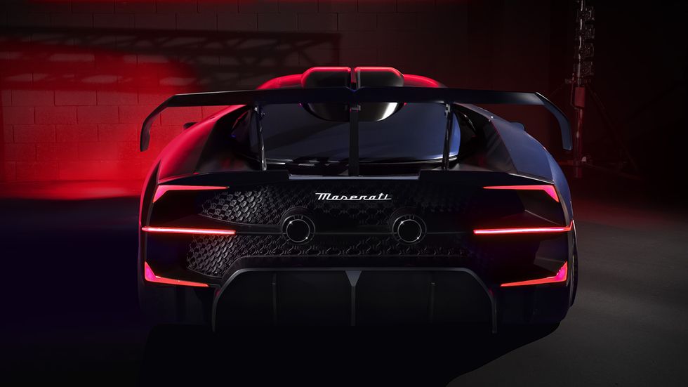 2024 maserati mcxtrema rear end photographed with red and purple hues in a studio environment