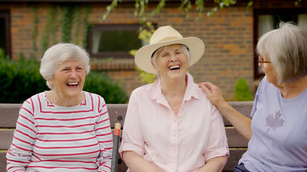 two older women chatting and smiling